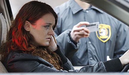 woman in a car pulled over